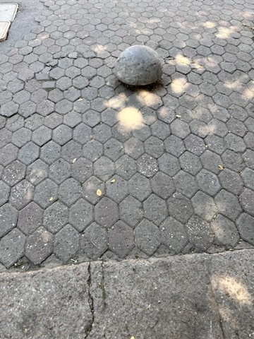 Istanbul sidewalk with a round mushroom bollard