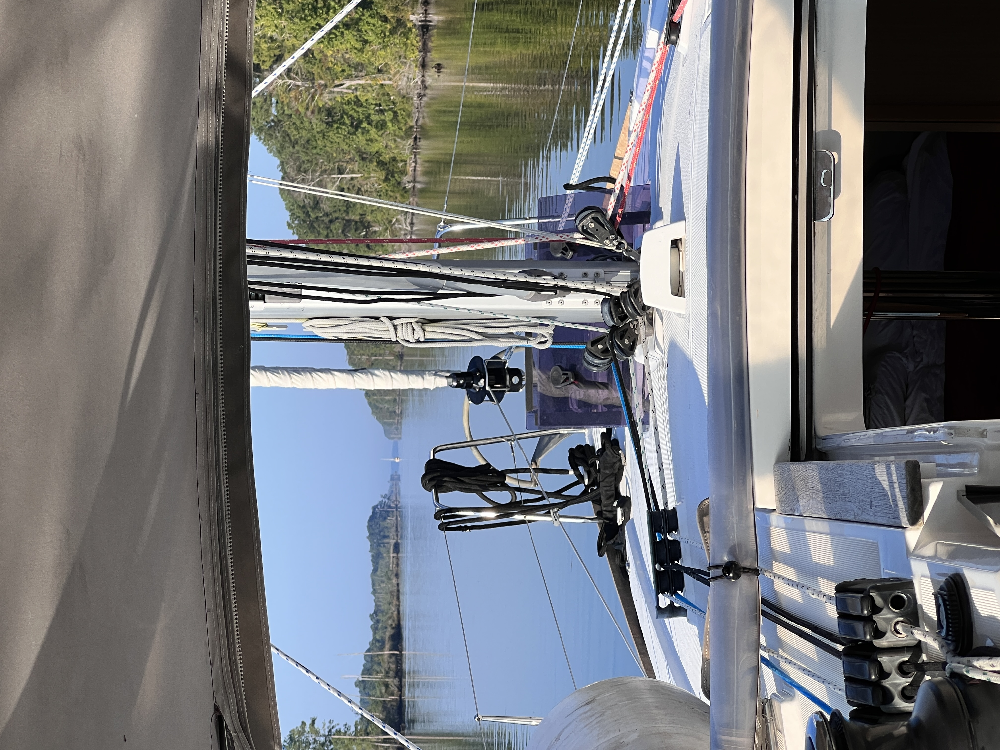 Photo of a sailboat headed down the intercoastal waterway in smooth water